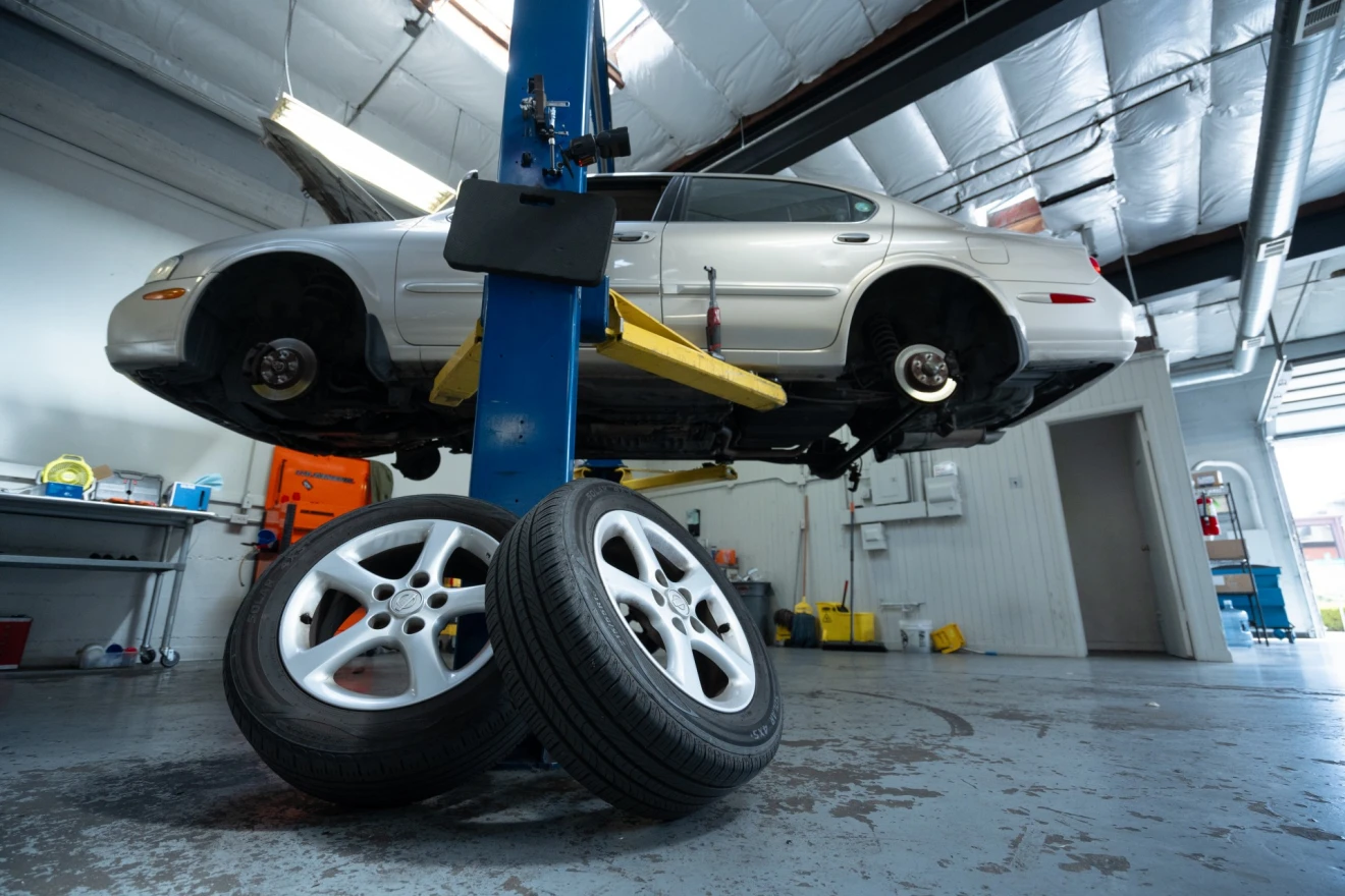 Vehicle lifted for tire service
